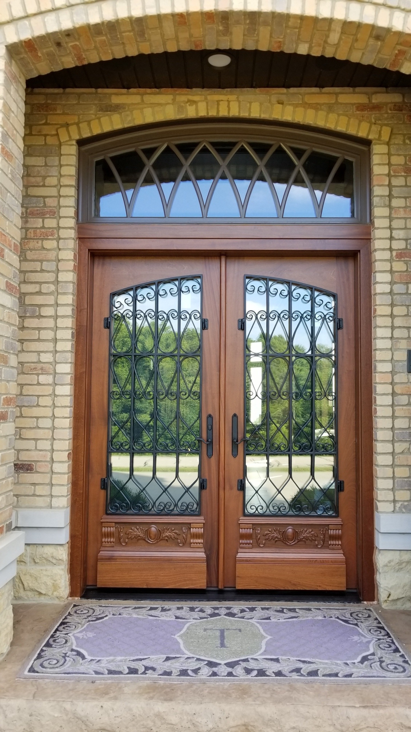 Custom Wood Entry Door with Iron Grate